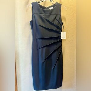 Calvin Klein sleeveless dress with sunburst ruched side detail.